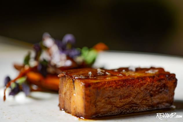 Pork Belly with baby maroon carrots, plums, cardamom-scented crème fraiche, vanilla, and sesame seeds.